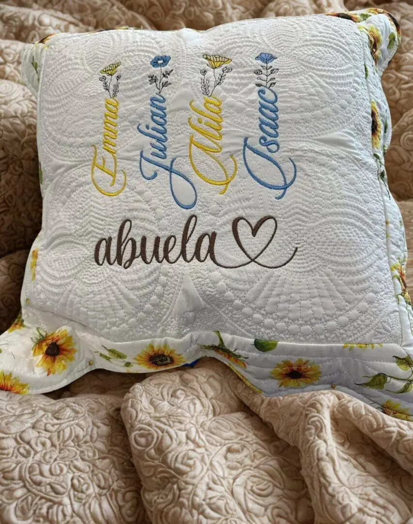 A pillow with the name of abuela on it