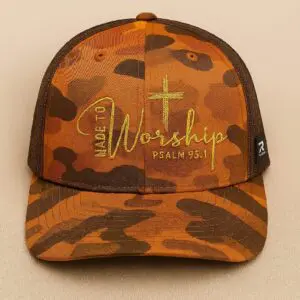 Camouflage cap with "Made to Worship" text.