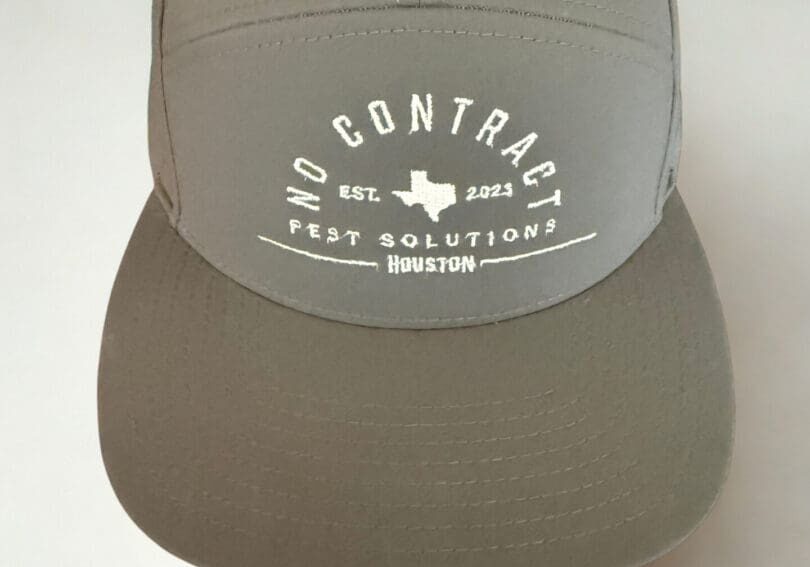 A gray hat with the words no contract test solutions on it.